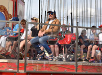 Jamie Oliver and Buddy Bear Maurice on fairground ride at Big Feastival
