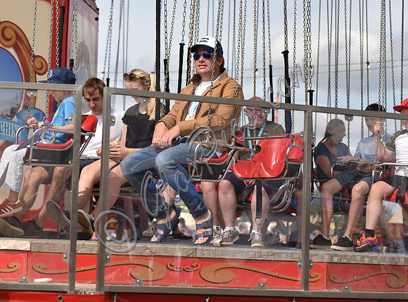 Jamie Oliver and Buddy Bear Maurice on fairground ride at Big Feastival