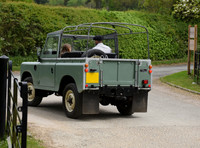 David and Harper Beckham in Land Rover pick-up (back view)