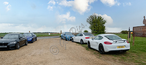 Performance cars at Diddly Squat Farm Shop