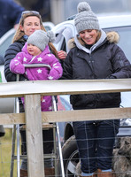 Zara Phillips with daughter held by Dolly Maude wear matching woolly hats
