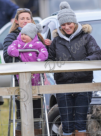 Zara Phillips with daughter held by Dolly Maude wear matching woolly hats