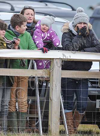 Zara Phillips and daughter held by Dolly Maude wear matching woolly hats