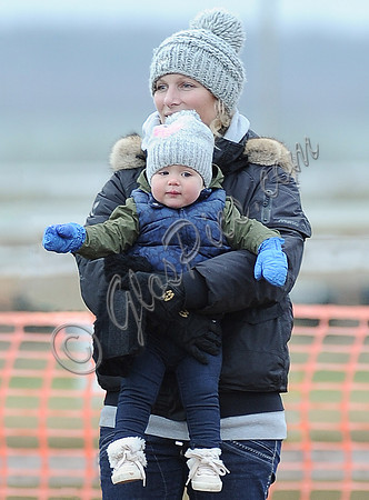 Zara Phillips with daughter wearing matching woolly hats