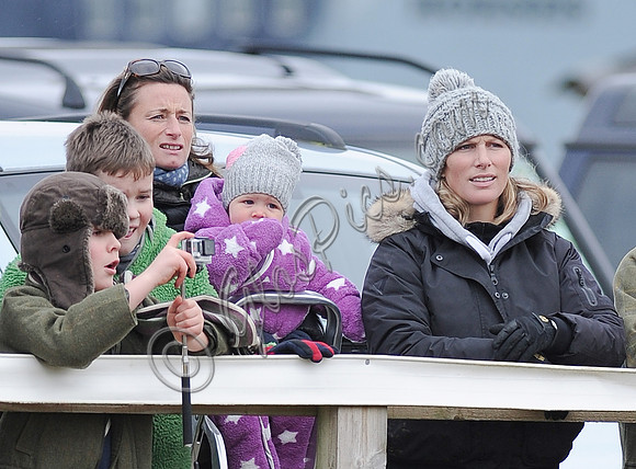Zara Phillips with daughter held by Dolly Maude wear matching woolly hats