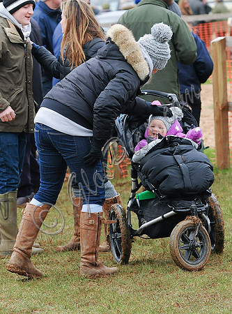 Zara Phillips with daughter in buggy wearing matching woolly hats