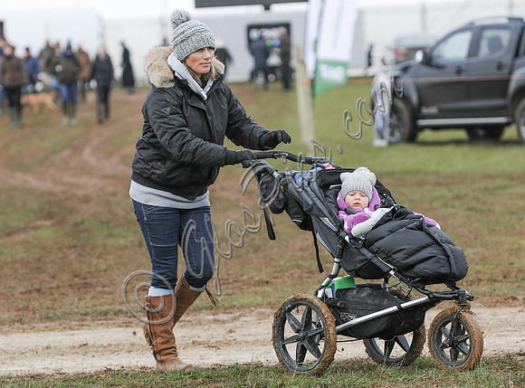 Zara Phillips with Daughter in buggy wearing matching woolly hats