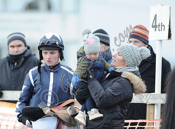 Jockey with Zara Phillips with daughter wearing matching woolly hats