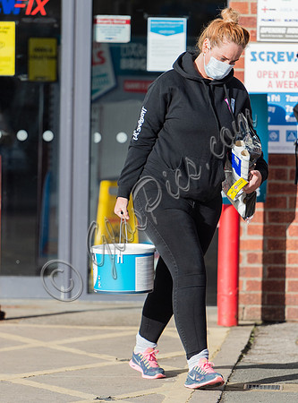 Josie Gibson in black tracksuit and trainers