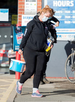 Josie Gibson in black tracksuit and trainers