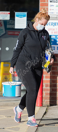 Josie Gibson in black tracksuit and trainers