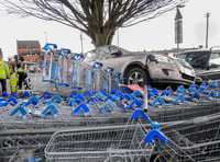 Car flattens bike stand and mounts row of trolleys in accident in Tewkesbury, Gloucestershire