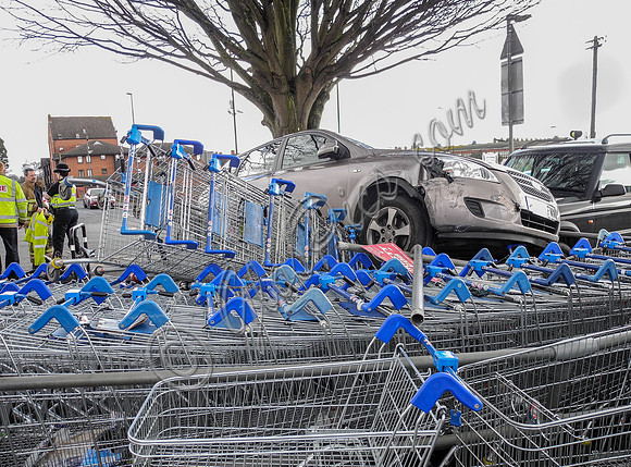 Car flattens bike stand and mounts row of trolleys in accident in Tewkesbury, Gloucestershire