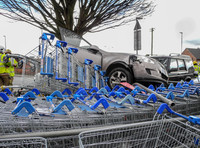 Car flattens bike stand and mounts row of trolleys in accident in Tewkesbury, Gloucestershire