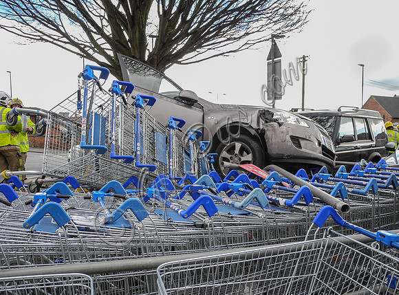 Car flattens bike stand and mounts row of trolleys in accident in Tewkesbury, Gloucestershire