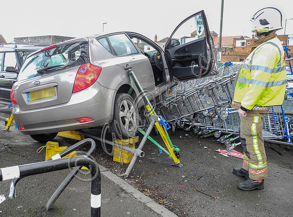 Car flattens bike stand and mounts row of trolleys in accident in Tewkesbury, Gloucestershire