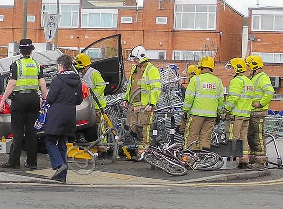 Car flattens bike stand and mounts row of trolleys in accident in Tewkesbury, Gloucestershire