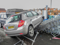 Car flattens bike stand and mounts row of trolleys in accident in Tewkesbury, Gloucestershire