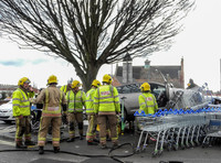 Car flattens bike stand and mounts row of trolleys in accident in Tewkesbury, Gloucestershire