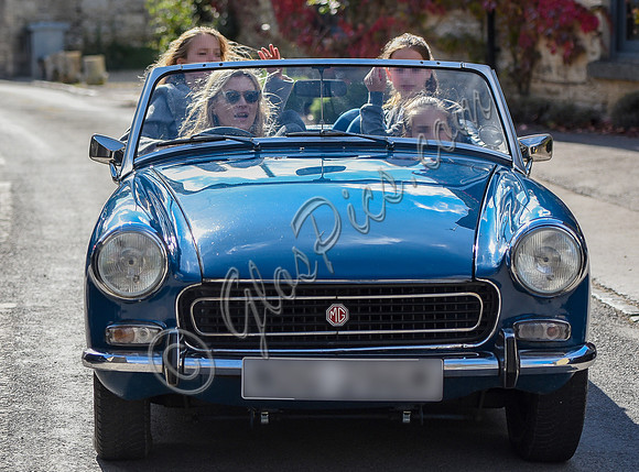 Kate Moss driving her MG Midget