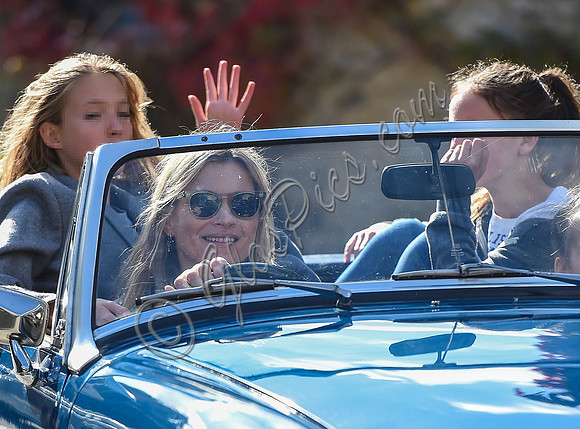 Kate Moss driving her MG Midget