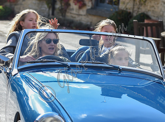 Kate Moss driving her MG Midget