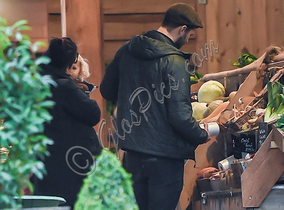 Jamie Dornan selecting vegetables at Farmers Market