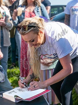 Daisy May Cooper autographing