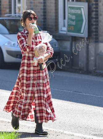 Amelia Warner wearing red and white check dress