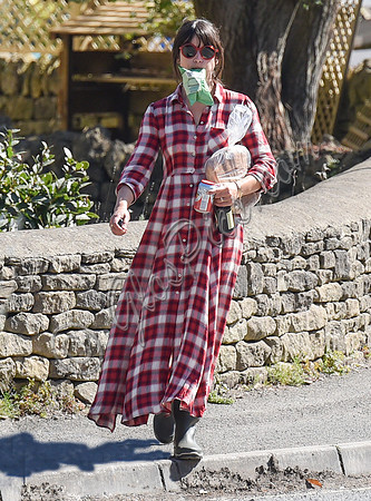 Amelia Warner wearing red and white check dress