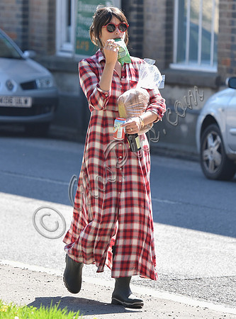 Amelia Warner wearing red and white check dress