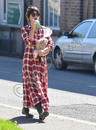 Amelia Warner wearing red and white check dress