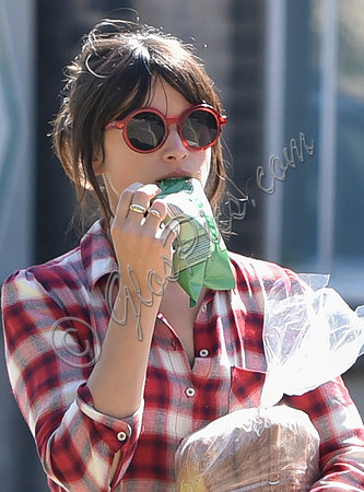 Amelia Warner wearing red and white check dress, close-up