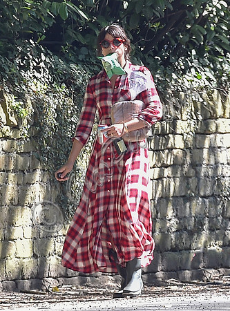 Amelia Warner wearing red and white check dress