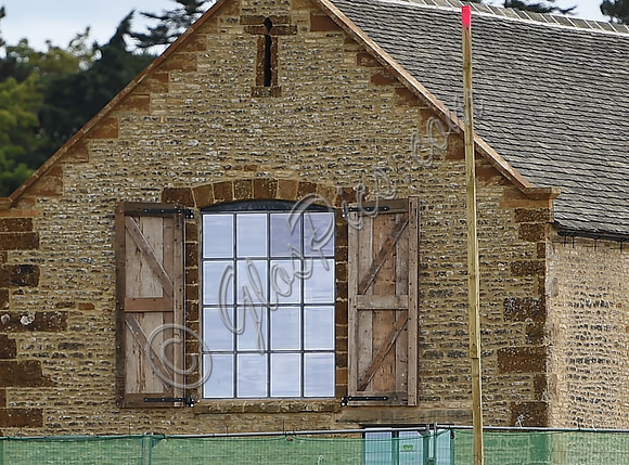 "Crittall" window with reclaimed timber shutters