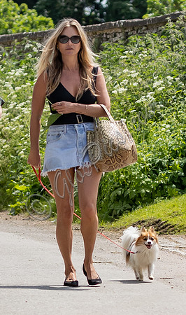 Kate Moss in denim mini skirt