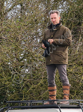Red Bull team principal wearing country jacket and long boots at Point to point races