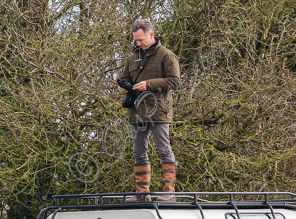 Red Bull team principal wearing country jacket and long boots at Point to point races