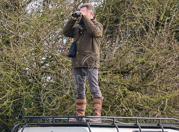 Red Bull team principal wearing country jacket and long boots at Point to point races
