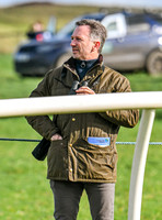 Red Bull team principal wearing country jacket and long boots at Point to point races