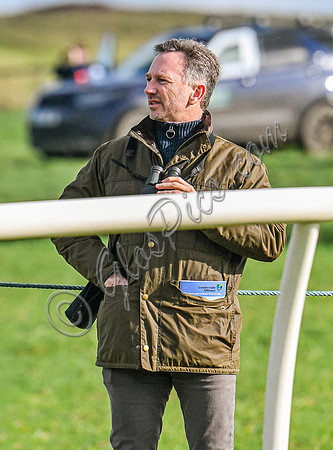 Red Bull team principal wearing country jacket and long boots at Point to point races