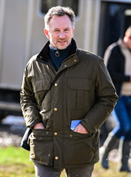 Red Bull team principal wearing country jacket and long boots at Point to point races