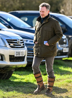 Red Bull team principal wearing country jacket and long boots at Point to point races