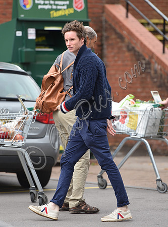 Eddie Redmayne wearing blue cardigan, skinny jeans and trainers on shopping trip to Stroud
