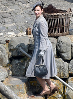 Lily James filming scenes for upcoming WWII movie "Guernsey Literary And Potato Peel Pie Society" in Clovelly Harbour, North Devon, United Kingdom  - 5th May, 2017