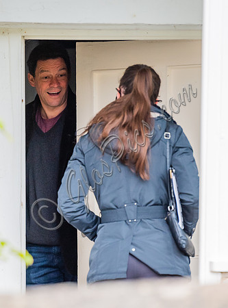 Dominic West answers door