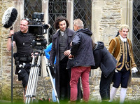 Aidan Turner and crew members in front of Chavenage House
