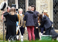 Aidan Turner and crew members in front of Chavenage House