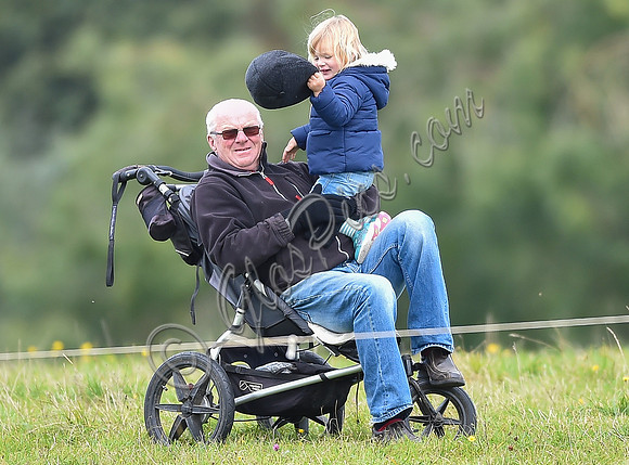 mischievous Mia Tindall plays with elderly family friend