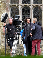 Aidan Turner and crew members in front of Chavenage House